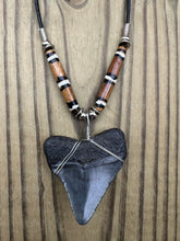 Load image into Gallery viewer, 2 inch Fossilized Megalodon Shark Tooth Necklace featuring Brown Bones with White Rings
