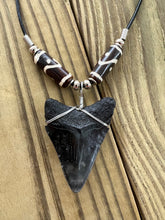 Load image into Gallery viewer, Fossilized 2-Inch Megalodon Shark Tooth Necklace with Tribal Bone Beads
