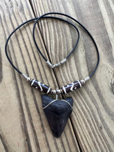 Load image into Gallery viewer, Fossilized 2-Inch Megalodon Shark Tooth Necklace with Tribal Bone Beads
