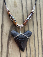 Load image into Gallery viewer, Sleek Black Megalodon Shark Tooth Necklace with Brown Bone Beads 1 11/16 Inch
